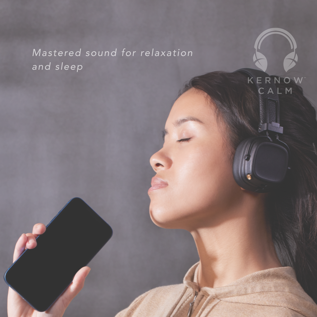A woman in profile wearing black over-ear headphones and holding a smartphone, with the text 'Mastered sound for relaxation and sleep' and the brand name 'KERNOW CALM' on a gray background.